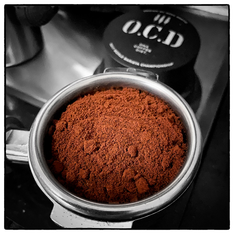 Ground Coffee in Porafilter and OCD Coffee Distributor